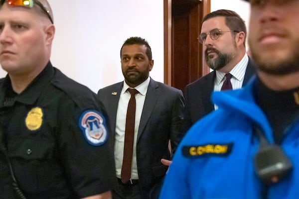 FILE - Kash Patel, President-elect Donald Trump's pick to be the director of the FBI, walks between meetings on Capitol Hill, Dec. 9, 2024, in Washington. (AP Photo/Mark Schiefelbein, File)