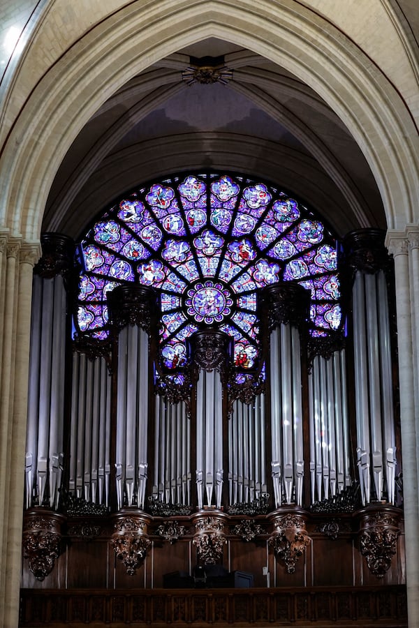 The western Rose window and the organ of Notre-Dame de Paris cathedral are seen while French President Emmanuel Macron visits the restored interiors of the monument, Friday Nov. 29, 2024, in Paris. (Stephane de Sakutin, Pool via AP)