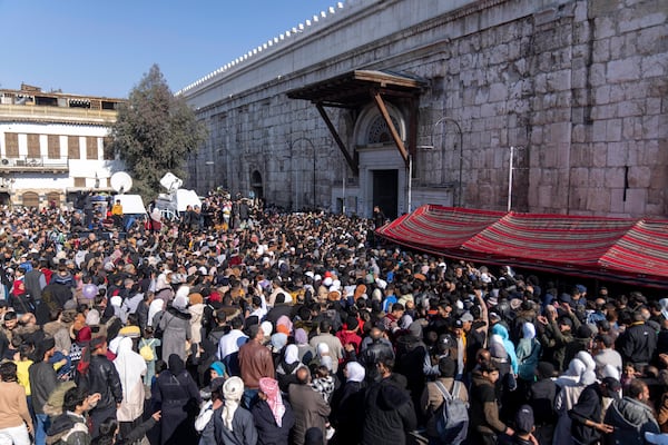 People gather to enter Umayyad Mosque for Friday prayers, in Damascus, Syria, Friday, Jan. 10, 2025. (AP Photo/Mosa'ab Elshamy)