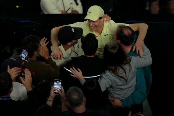 Jannik Sinner of Italy celebrates after defeating Alexander Zverev of Germany in the men's singles final at the Australian Open tennis championship in Melbourne, Australia, Sunday, Jan. 26, 2025. (AP Photo/Manish Swarup)