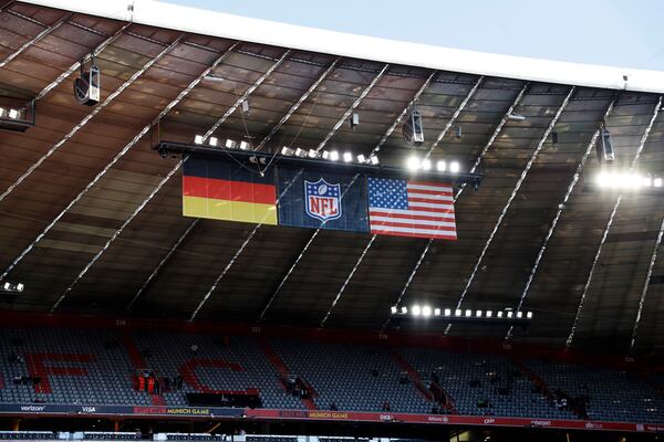 FILE - The German, NFL, and United States flags are displayed in the stadium before an NFL football game between the Tampa Bay Buccaneers and the Seattle Seahawks at Allianz Arena in Munich, Germany, Sunday, Nov. 13, 2022. (AP Photo/Steve Luciano, File)