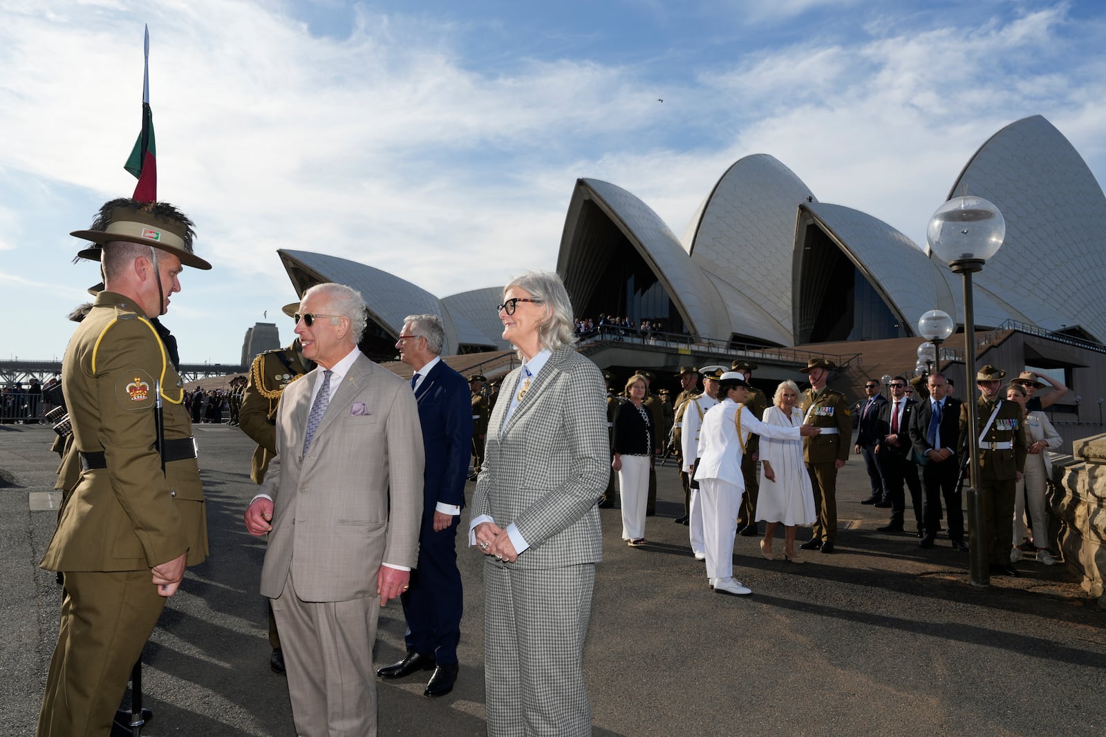 Britain's King Charles III, second from left, talks to an honor guard beside Australia's Governor-General Sam Mostyn during his visit to Sydney Opera House in Sydney, Australia, Tuesday, Oct. 22, 2024. (AP Photo/Mark Baker, Pool)