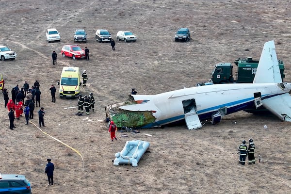 The wreckage of Azerbaijan Airlines Embraer 190 lays on the ground near the airport of Aktau, Kazakhstan, Wednesday, Dec. 25, 2024. (AP Photo/Azamat Sarsenbayev)