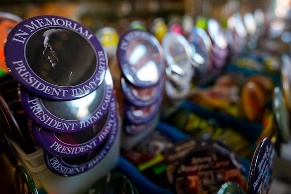 An In Memorium button for former President Jimmy Carter is seen inside the Plains Trading Post, Monday, Dec. 30, 2024, in Plains, Ga. Former President Jimmy Carter died Sunday at the age of 100. (AP Photo/Mike Stewart)