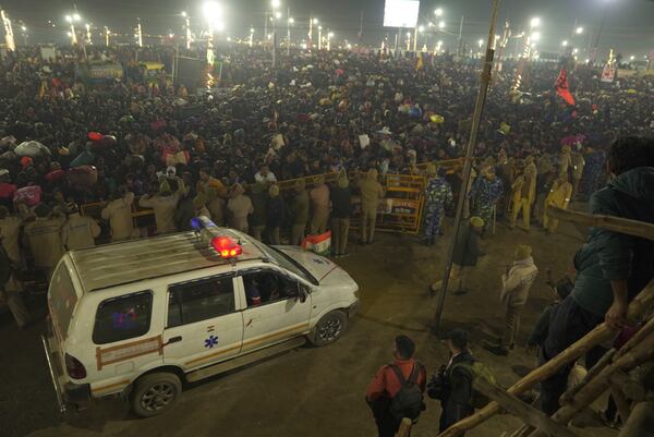 An ambulance arrives by the site of a stampede on the Sangam, the confluence of the Ganges, the Yamuna and the mythical Saraswati rivers, on "Mauni Amavasya" or new moon day during the Maha Kumbh festival, in Prayagraj, Uttar Pradesh, India, Wednesday, Jan. 29, 2025. (AP Photo)