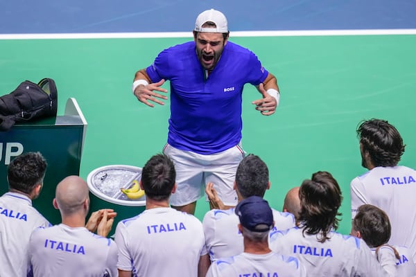 Italy's Matteo Berrettini celebrates after beating Australia's Thanasi Kokkinakis during the Davis Cup semifinal at the Martin Carpena Sports Hall in Malaga, southern Spain, on Saturday, Nov. 23, 2024. (AP Photo/Manu Fernandez)