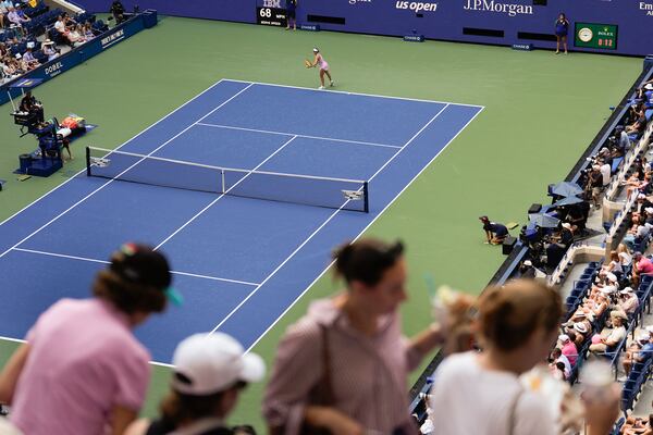 FILE - Spectators move to their seats during play between Varvara Gracheva, of France, and Coco Gauff, of the United States, during the first round of the U.S. Open tennis championships, Monday, Aug. 26, 2024, in New York. (AP Photo/Matt Rourke, File)