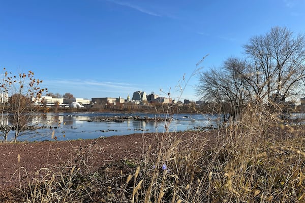 The Delaware River overlooking Trenton, N.J. flows downstream as seen from from Morrisville, Pa., on Monday, Nov. 25, 2024. (AP Photo/Mike Catalini)