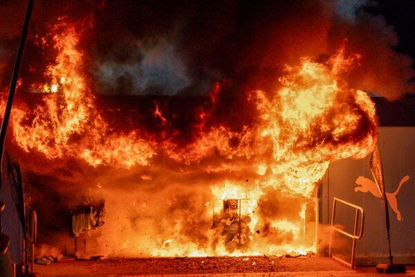 A fire burns at a merchandise kiosk outside the Etihad Stadium before the Champions League opening phase soccer match between Manchester City and Brugge in Manchester, England, Wednesday, Jan. 29, 2025.(AP Photo/Dave Thompson)