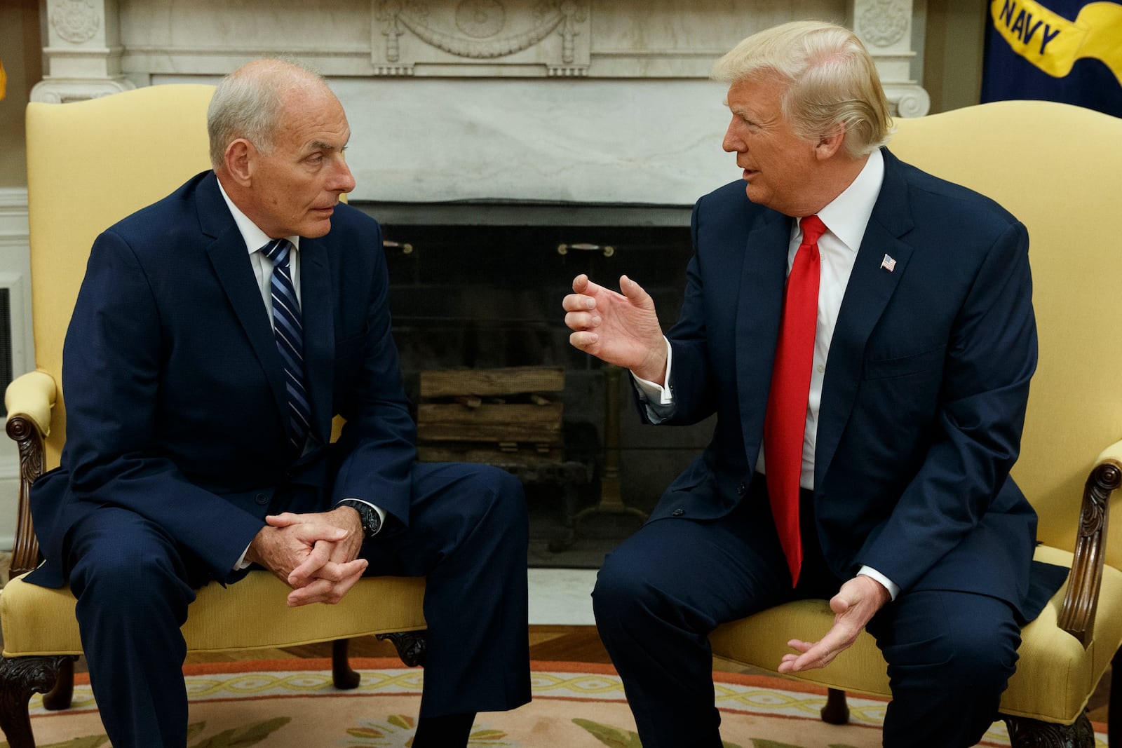 FILE - President Donald Trump talks with White House Chief of Staff John Kelly after he was privately sworn in during a ceremony in the Oval Office in Washington, July 31, 2017. (AP Photo/Evan Vucci, File)