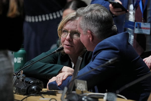 Austria Climate Minister Leonore Gewessler, left, talks with Australia Climate Minister Chris Bowen before a plenary session at the COP29 U.N. Climate Summit, Thursday, Nov. 21, 2024, in Baku, Azerbaijan. (AP Photo/Peter Dejong)