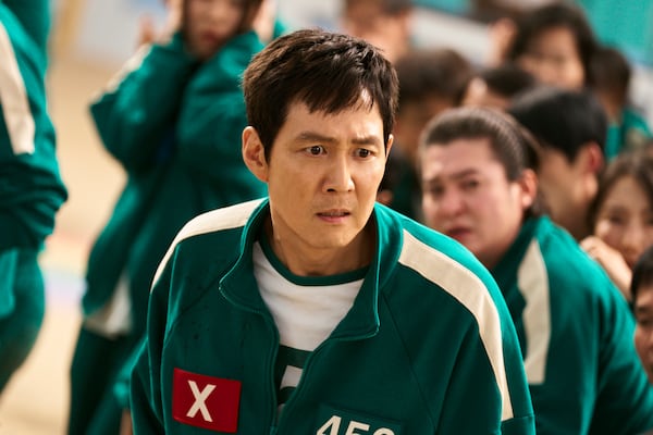 This image released by Netflix shows Lee Jung-jae in a scene from "Squid Game." (No Ju-han/Netflix via AP)