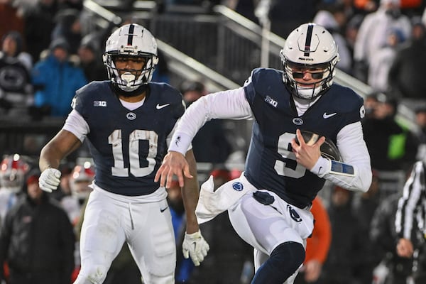 Penn State quarterback Beau Pribula (9) scores a touchdown against Maryland during the second quarter of an NCAA college football game, Saturday, Nov. 30, 2024, in State College, Pa. (AP Photo/Barry Reeger)