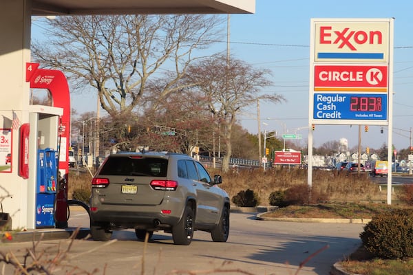 A car waits to be filled with gasoline at a station in Point Pleasant Beach, N.J. on Thursday, Dec. 12, 2024. (AP Photo/Wayne Parry)