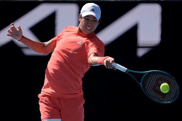 Learner Tien of the U.S. plays a forehand return to Corentin Moutet of France during their third round match at the Australian Open tennis championship in Melbourne, Australia, Saturday, Jan. 18, 2025. (AP Photo/Ng Han Guan)