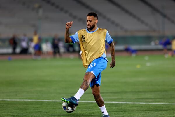 FILE - Al Hilal's Neymar shoots the ball during warm up for the AFC Champions League soccer match against Iran's Nassaji at the Azadi Stadium in Tehran, Iran, Oct. 3, 2023. (AP Photo, File)