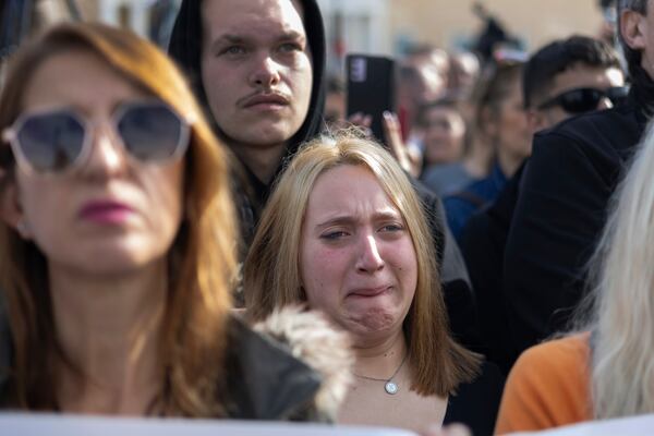 A woman reacts during a rally organised by the association of the families of victims of the Tempi train collision, which killed 57 people almost two years ago, at central Syntagma square, in Athens, Greece, Sunday, Jan. 26, 2025. (AP Photo/Yorgos Karahalis)