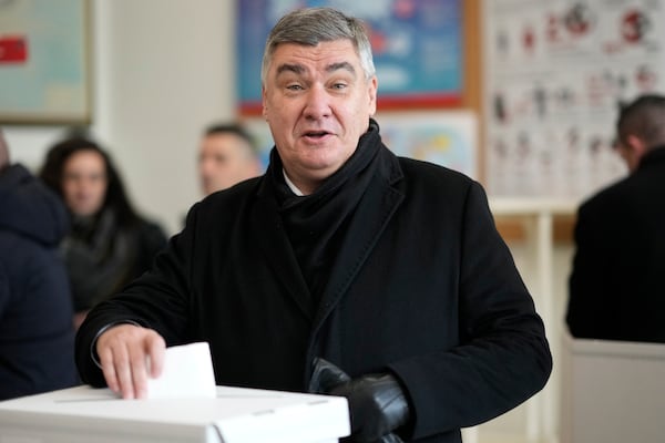 President incumbent Zoran Milanovic casts his ballot during a runoff vote for the Croatian presidential election at a polling station in Zagreb, Croatia, Sunday, Jan. 12, 2025. (AP Photo/Darko Bandic)