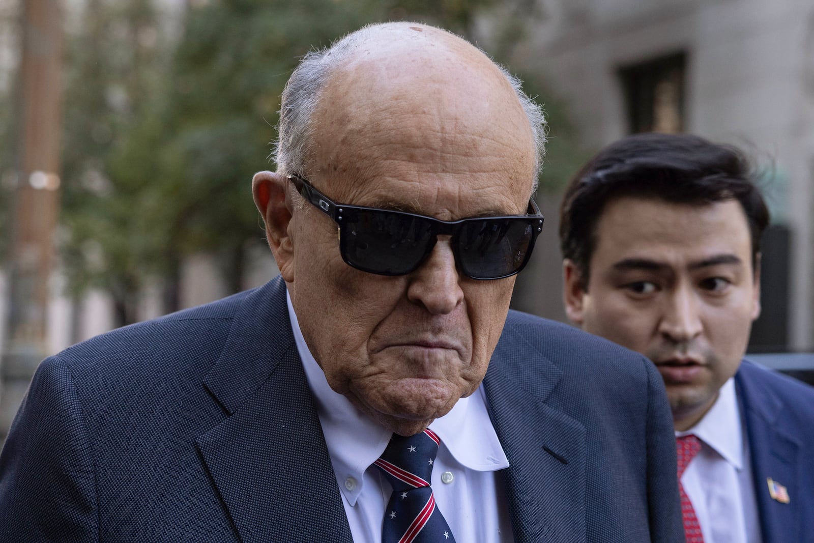 Former New York City Mayor Rudy Giuliani arrives at the court to explain to a federal judge why he hasn't surrendered his valuables as part of a $148 million defamation judgment, in New York, Thursday, Nov. 7, 2024. (AP Photo/Yuki Iwamura)