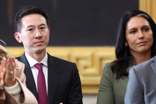 TikTok CEO Shou Zi Chew, center, and Trump's nominee to be Director of National Intelligence Tulsi Gabbard, right, attend the 60th Presidential Inauguration in the Rotunda of the U.S. Capitol in Washington, Monday, Jan. 20, 2025. (Kevin Lamarque/Pool Photo via AP)