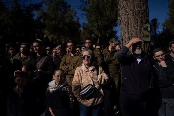 Mourners attend the funeral of Israeli soldier 1st Matityahu Ya'akov Perel, who was killed in a battle in the Gaza Strip, at the Mount Herzl military cemetery in Jerusalem, Israel, Thursday, Jan. 9, 2025. (AP Photo/Ohad Zwigenberg)