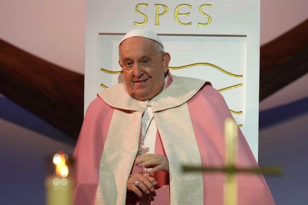 Pope Francis celebrates a mass Sunday, Dec. 15, 2024 in Ajaccio, Corsica island, on the first papal visit ever to the French island of Corsica and called for a dynamic form of laicism, promoting the kind of popular piety that distinguishes the Mediterranean island from secular France as a bridge between religious and civic society. (AP Photo/Thibault Camus)