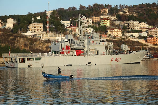 An Italian navy ship approaches the port, as Italy sends 49 more migrants to Albania for processing following earlier court rejections, in Shengjin, northwestern Albania, Tuesday, Jan. 28, 2025. (AP Photo/Vlasov Sulaj)