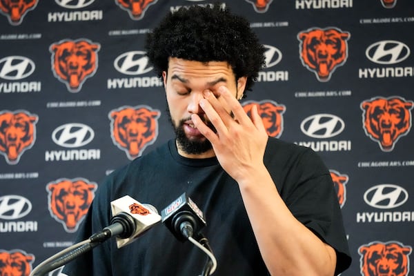 Chicago Bears quarterback Caleb Williams wipes his eyes as he talks with reporters after an NFL football game against the Seattle Seahawks, Thursday, Dec. 26, 2024, in Chicago. (AP Photo/Nam Y. Huh)