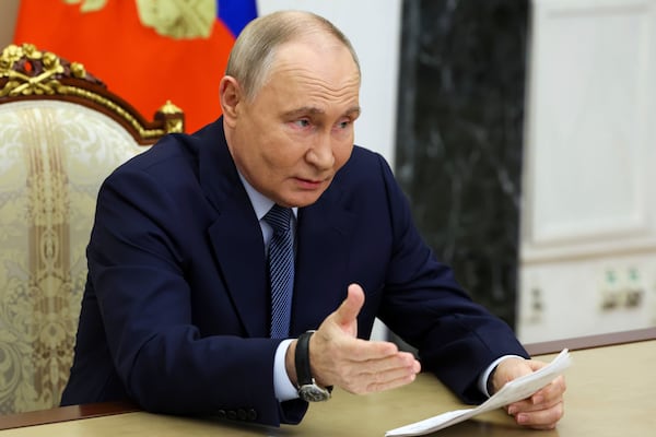 Russian President Vladimir Putin gestures while speaking during a meeting with the leadership of the Russian Ministry of Defense, representatives of the military-industrial complex and developers of missile systems at the Kremlin in Moscow, Russia, Friday, Nov. 22, 2024. (Vyacheslav Prokofyev/Sputnik, Kremlin Pool Photo via AP)