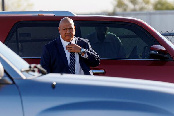 Former Uvalde school district police chief Pete Arredondo prepares to walk into the Uvalde County Justice Center for a pre-trial hearing, Thursday morning, Dec. 19, 2024, in Uvalde, Texas. (Sam Owens/The San Antonio Express-News via AP)