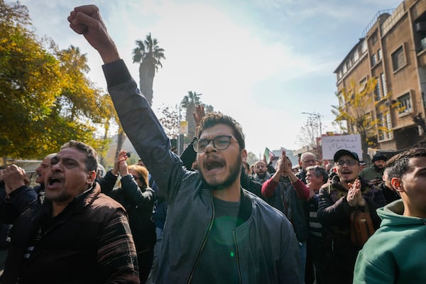 A man shouts during the funeral of Syrian activist Mazen al-Hamada in Damascus Thursday Dec. 12, 2024. Al-Hamad's mangled corpse was found wrapped in a bloody sheet in Saydnaya prison. He had fled to Europe but returned to Syria in 2020 and was imprisoned upon arrival. (AP Photo/Hussein Malla)