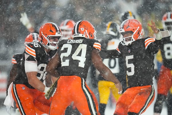 Cleveland Browns running back Nick Chubb (24) celebrates his touchdown with quarterback Jameis Winston (5) and tight end Blake Whiteheart (86) in the second half of an NFL football game against the Pittsburgh Steelers, Thursday, Nov. 21, 2024, in Cleveland. (AP Photo/Sue Ogrocki)