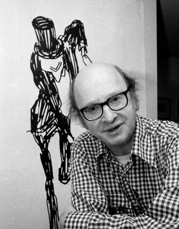 FILE - Cartoonist, Playwright Jules Feiffer appears in his New York City apartment on April 29, 1977. (AP Photo/Marty Lederhandler, File)