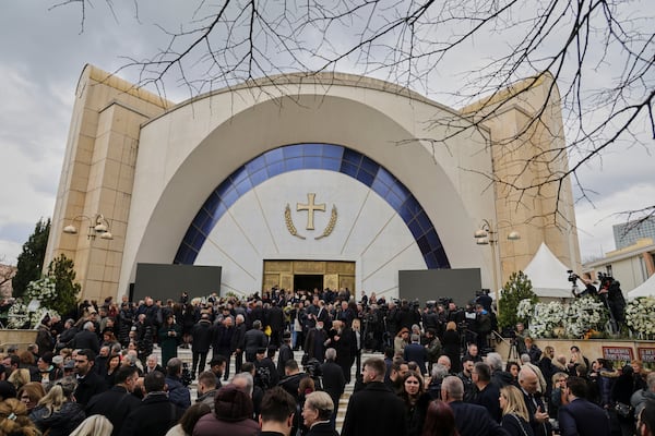 People gather during the funeral of the late Archbishop Anastasios of Tirana, Durres and All Albania, at the Cathedral of the Resurrection of Christ, in Tirana, Albania, Thursday, Jan. 30, 2025. (AP Photo/Vlasov Sulaj)