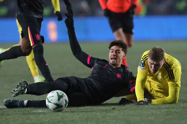 Chelsea's Marc Guiu, left, fights for the ball with Astana's Alexandr Marochkin during the Europa Conference League opening phase soccer match between Astana and Chelsea at the Almaty Ortalyk stadium in Almaty, Kazakhstan, Thursday, Dec. 12, 2024. (AP Photo)