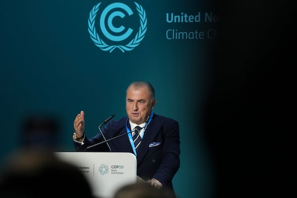 Fatih Terim, football manager and former player, speaks during an event on the Football Clubs Alliance for Climate at the COP29 U.N. Climate Summit, Saturday, Nov. 16, 2024, in Baku, Azerbaijan. (AP Photo/Sergei Grits)