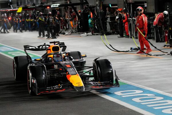 Red Bull driver Max Verstappen, of the Netherlands, drives on pit row during the F1 Las Vegas Grand Prix auto race, Saturday, Nov. 23, 2024, in Las Vegas. (AP Photo/John Locher, Pool)