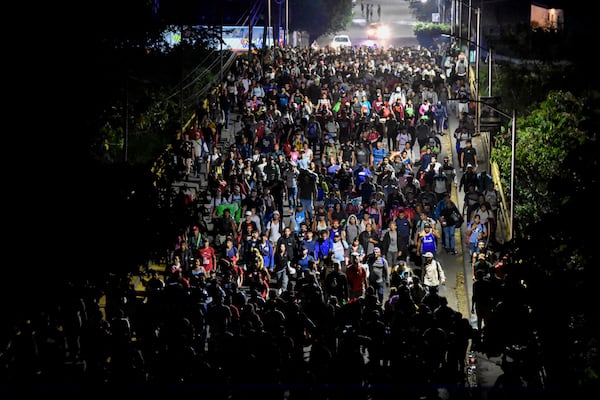 Migrants walk through Tapachula, Chiapas state, Mexico, Thursday, Jan. 2, 2025, in an attempt to reach the U.S. border. (AP Photo/Edgar H. Clemente)