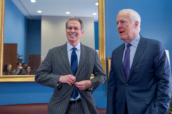 Scott Bessent, left, President-elect Donald Trump's nominee to be Treasury secretary, meets with Sen. John Cornyn, R-Texas, a member of the Senate Finance Committee which will preside over Bessent's confirmation, at the Capitol in Washington, Tuesday, Jan. 7, 2025. (AP Photo/J. Scott Applewhite)