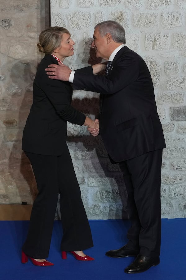 Italian Foreign Minister Antonio Tajani, greets Canada's Foreign Minister Melanie Joly as she arrives for a family photo at the G7 of foreign Ministers in Anagni, some 70 kilometers south-east of Rome, Monday, Nov. 25, 2024. (AP Photo/Alessandra Tarantino)