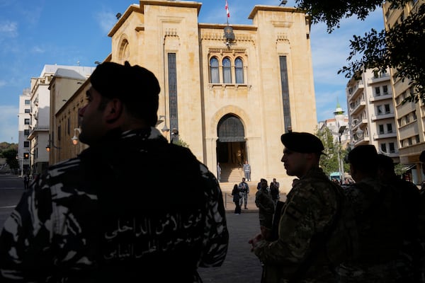 Lebanese troops stand guard in front of the parliament building before a session to elect a new Lebanese president in down town Beirut, Lebanon, Thursday, Jan. 9, 2025. (AP Photo/Hussein Malla)