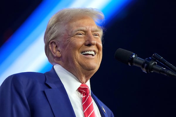 President-elect Donald Trump speaks at AmericaFest, Sunday, Dec. 22, 2024, in Phoenix. (AP Photo/Rick Scuteri)