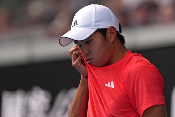 Learner Tien of the U.S. reacts during his fourth round win over Lorenzo Sonego of Italy at the Australian Open tennis championship in Melbourne, Australia, Monday, Jan. 20, 2025. (AP Photo/Ng Han Guan)