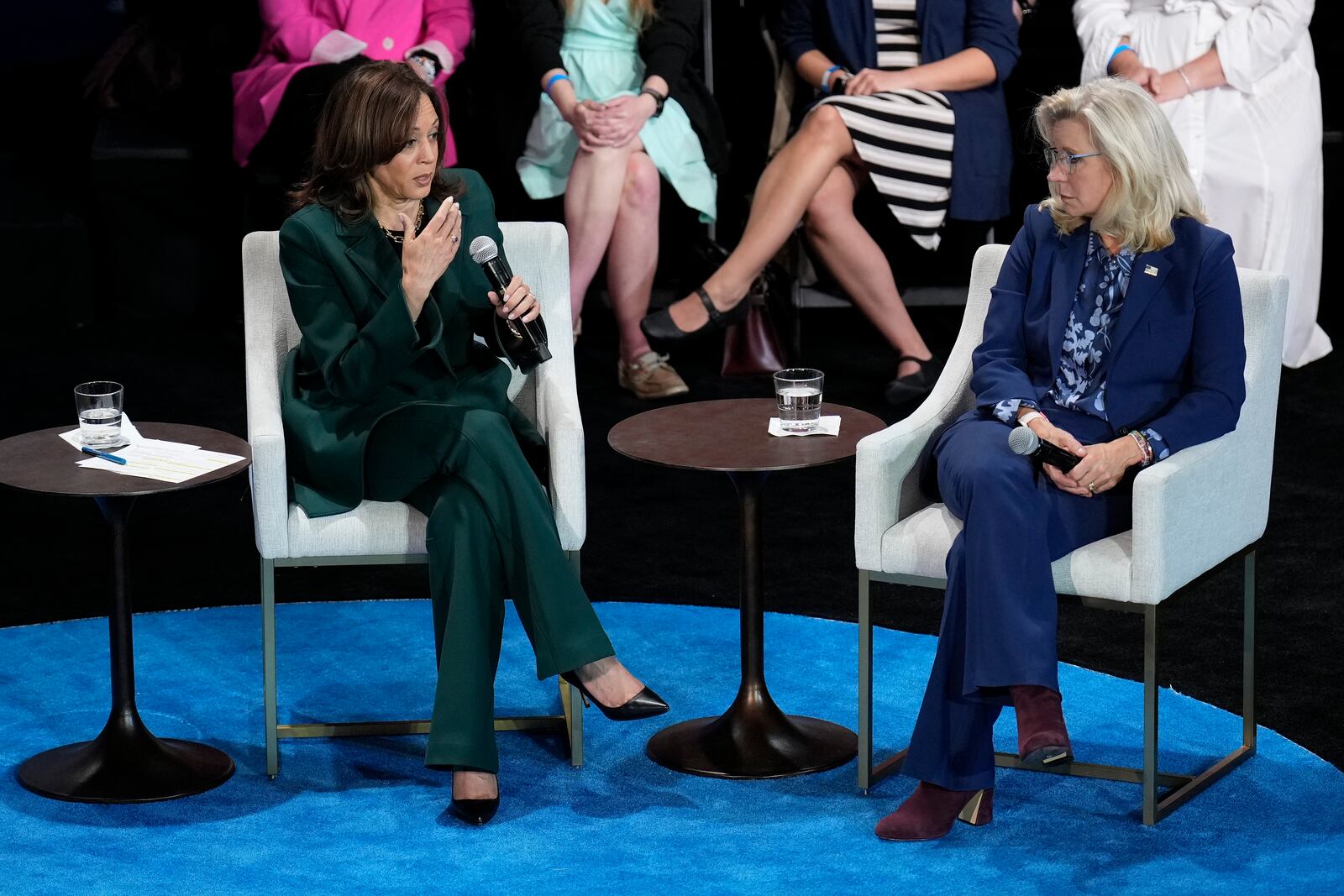 Democratic presidential nominee Vice President Kamala Harris, left, and former Congresswoman Liz Cheney, right, during a town hall at Sharon Lynne Wilson Center for the Arts in Brookfield, Wisc., Monday, Oct. 21, 2024. (AP Photo/Jacquelyn Martin)