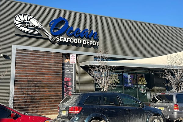 Cars sit parked outside an Ocean Seafood Depot store, Friday, Jan. 24, 2025, in Newark, N.J. . (AP Photo/Ted Shaffrey)