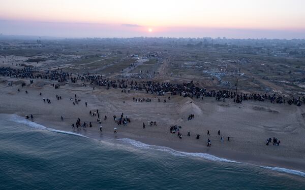 An aerial photograph taken by a drone shows displaced Palestinians return to their homes in the northern Gaza Strip, following Israel's decision to allow thousands of them to go back for the first time since the early weeks of the 15-month war with Hamas, Monday, Jan. 27, 2025. (AP Photo/ Mohammad Abu Samra)