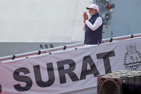 Indian Prime Minister Narendra Modi greets after the commissioning of INS Surat at a naval dockyard in Mumbai, India, Wednesday, Jan. 15, 2025. (AP Photo/Rafiq Maqbool)