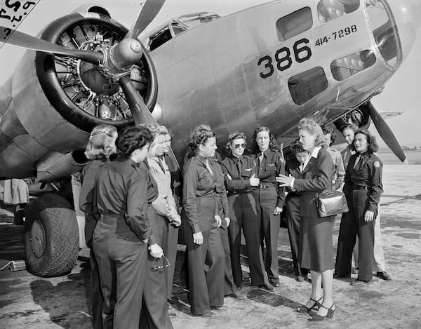 FILE - Jacqueline Cochran, director of Women Pilots for the Army Air Forces, talks to members of the Women Airforce Service Pilots before an AT10 plane at Camp Davis, N.C., Oct. 24, 1943. (AP Photo, File)