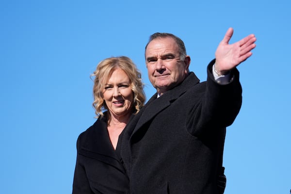 Gov. Michael Kehoe waves alongside first lady Claudia Kehoe, left, after being sworn in as Missouri's 58th governor Monday, Jan. 13, 2025, in Jefferson City, Mo. (AP Photo/Jeff Roberson)