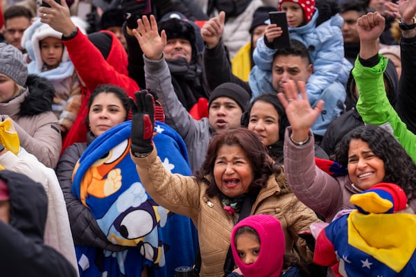 Petra Gambor, center, with her daughter Carolina di Martino Popovich, at right, reacts to a greeting by Venezuelan opposition leader Edmundo Gonzalez, outside of the Organization of American States, Monday, Jan. 6, 2025, in Washington. "We drove 10 hours in the snowstorm from Boston and we made it," said di Martino Popovich, "that is how much he means to us. We couldn't vote in Venezuela but we are here to recognize him as our president." The mother and daughter are long-time immigrants from Venezuela who live in Boston. (AP Photo/Jacquelyn Martin)